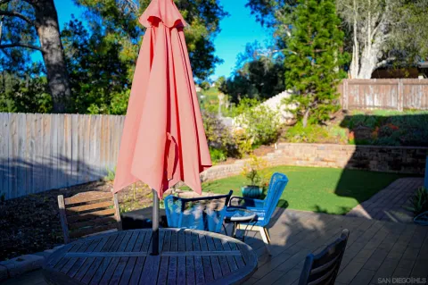 a view of outdoor sitting area with furniture and wooden floor