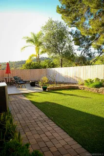a view of a swimming pool with an outdoor space and seating area