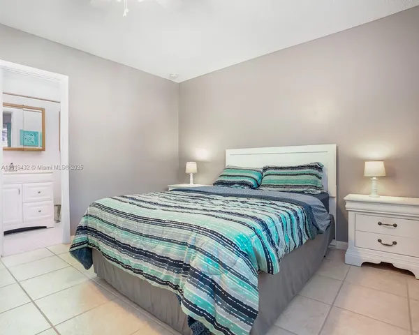 a bedroom with a bed and a cabinets