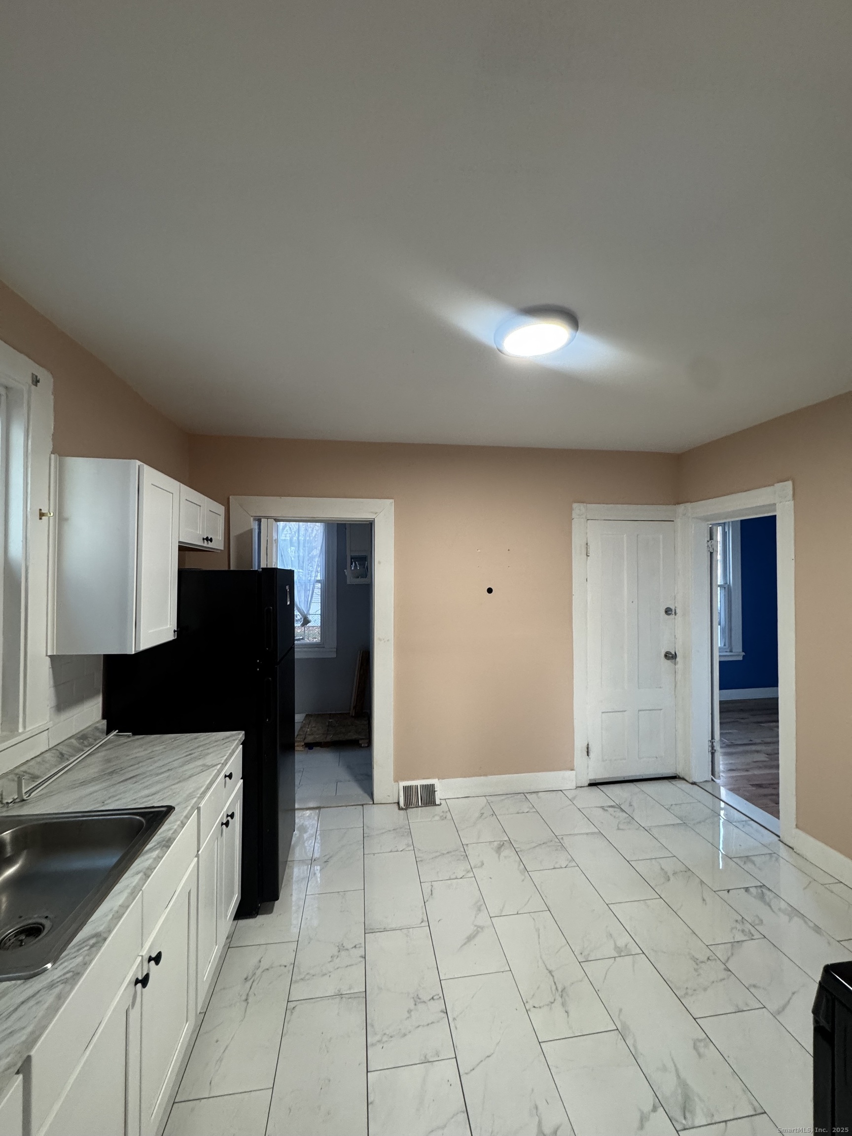 199 English Street, Unit 1 New Haven, CT 06513 - Photo 2 of 10 a kitchen with a refrigerator and a sink