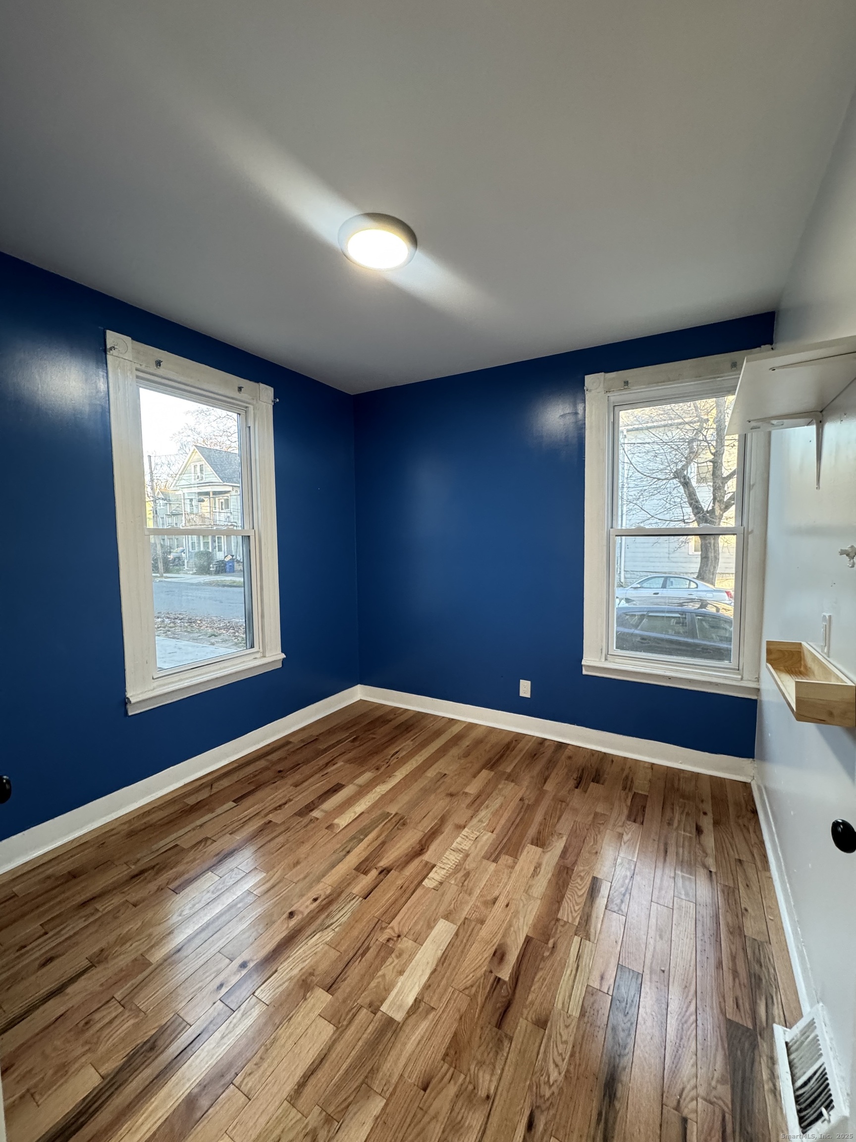 199 English Street, Unit 1 New Haven, CT 06513 - Photo 9 of 10 wooden floor in an empty room with a window