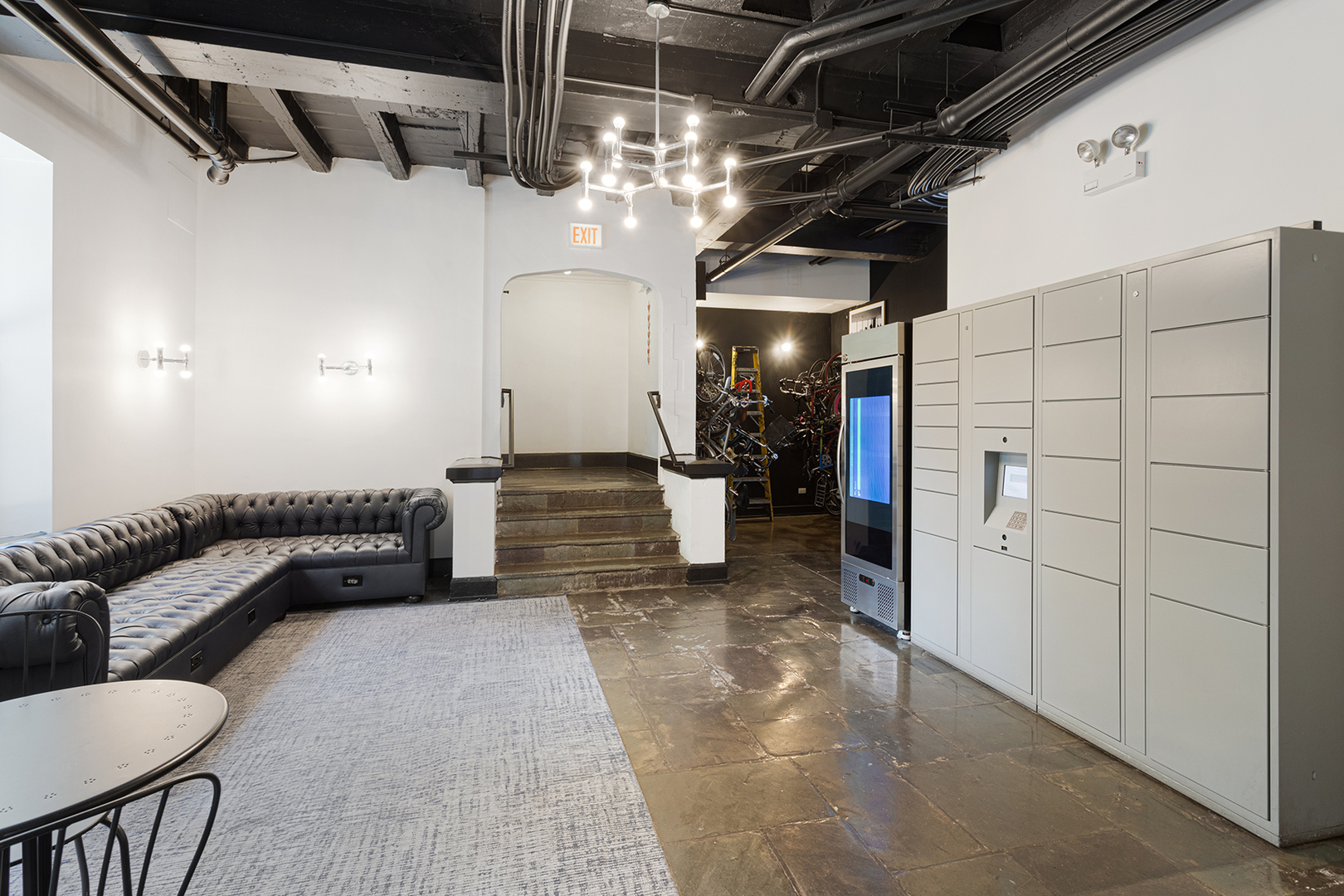 5718 North Winthrop Avenue, Unit 612 Chicago, IL 60660 - Photo 16 of 16 a view of a hallway with couch and chandelier