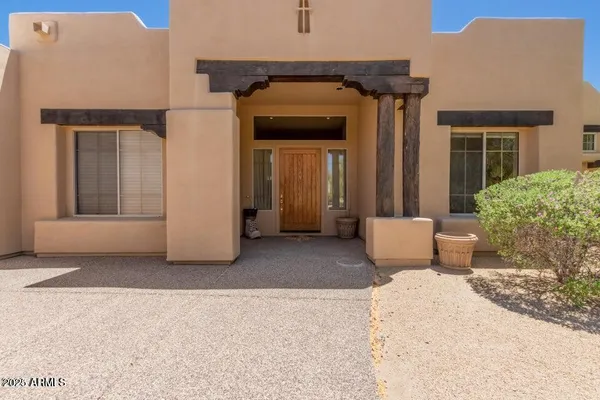 a view of a house with a door and balcony
