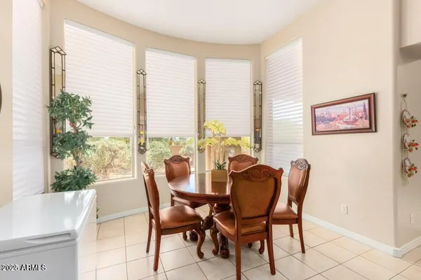 a view of a dining room with furniture and window