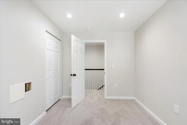 an empty room with closet area
