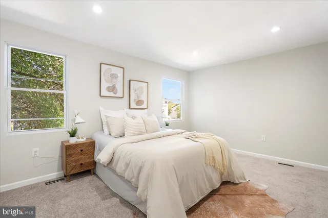 a bed room with a bed and a window