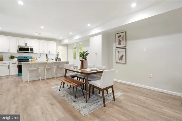a view of kitchen with cabinets and wooden floor