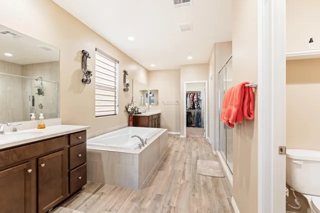 a view of a kitchen with a sink dishwasher stove and refrigerator