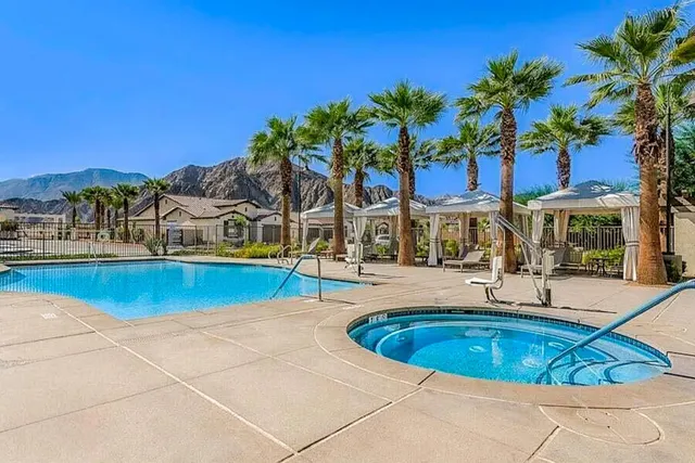 a view of a swimming pool with an outdoor seating