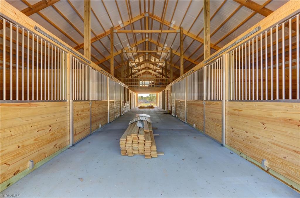 4245 Bridgehead Road Kernersville, NC 27284 - Photo 22 of 30 Front to back ventilation, pop out feed doors, 1500 SF hay loft with 2x12 floor trusses, could be finished. All BRAND NEW!
