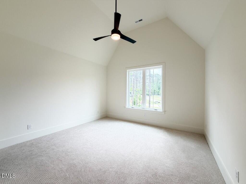 7441 Summer Tanager Trail Raleigh, NC 27614 - Photo 36 of 48 a view of an empty room with a window