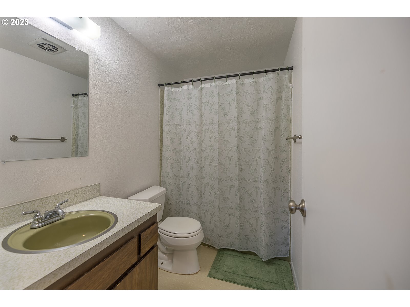 5326 B Street Springfield, OR 97478 - Photo 12 of 18 a bathroom with a granite countertop sink toilet and a mirror