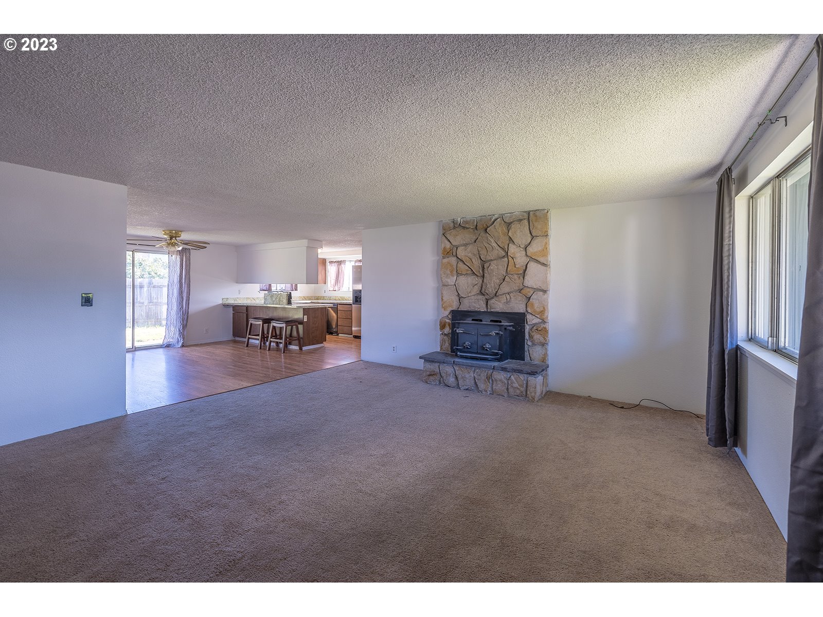 5326 B Street Springfield, OR 97478 - Photo 2 of 18 a living room with furniture and a dining table