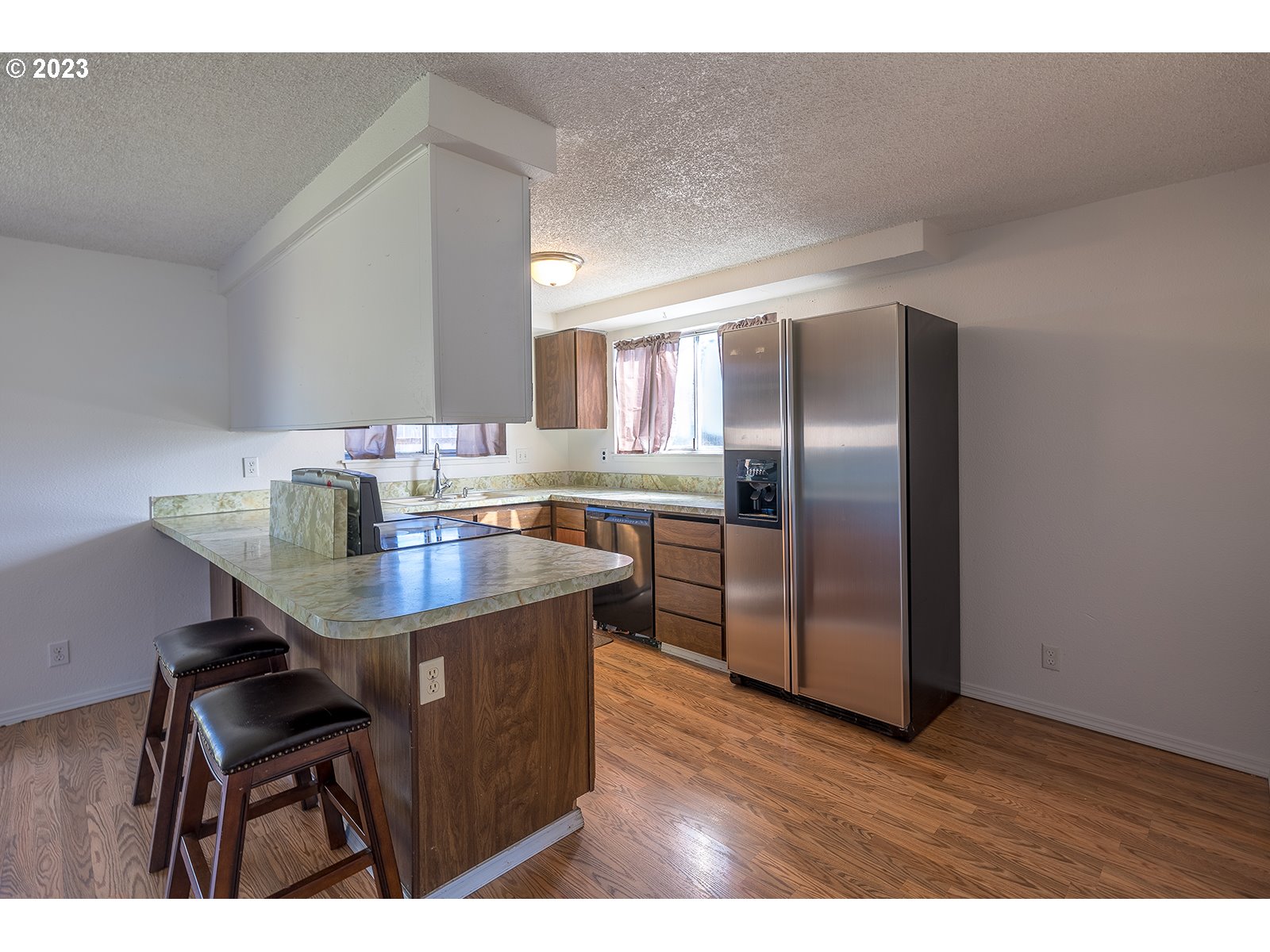 5326 B Street Springfield, OR 97478 - Photo 5 of 18 a kitchen with kitchen island a refrigerator stove a sink and dishwasher