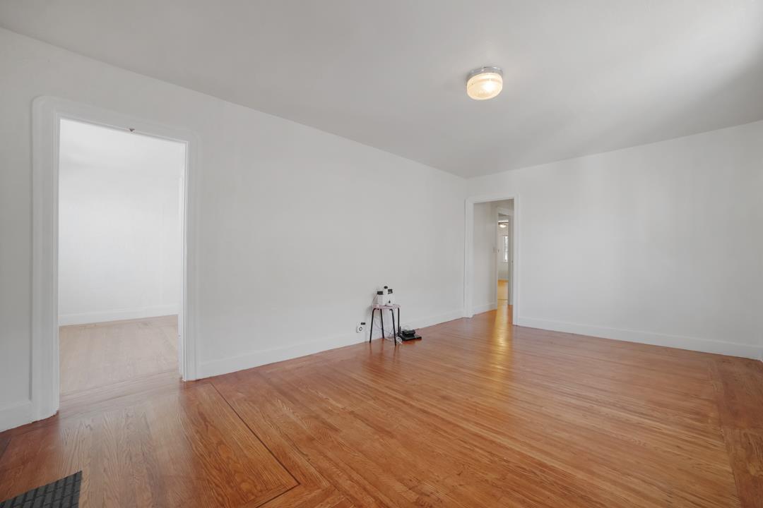 2276 35th Avenue Oakland, CA 94601 - Photo 3 of 32 a view of empty room with wooden floor