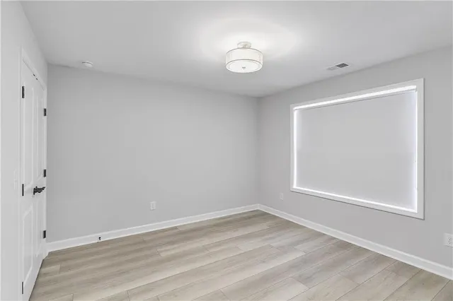 a view of room with window and ceiling fan