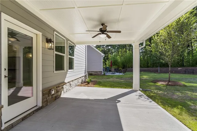 a view of a patio with a backyard