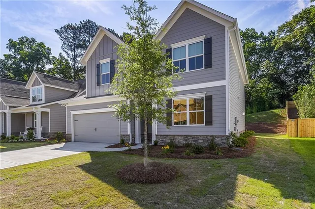 a front view of a house with garden