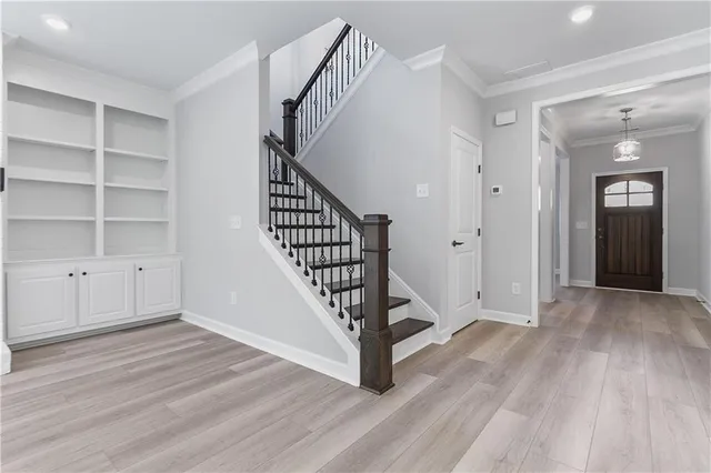 a view of an entryway with wooden floor