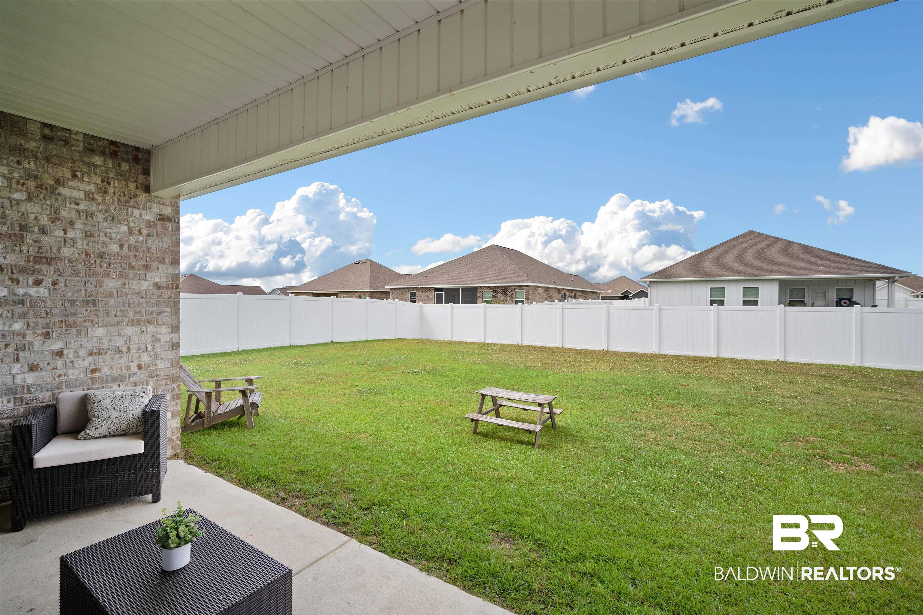11021 Native Dancer Way Daphne, AL 36526 - Photo 27 of 35 View of yard with a patio area and fence