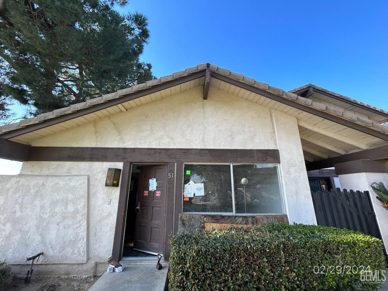 a front view of a house with garage