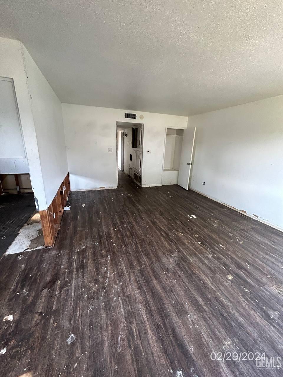 Undisclosed Address Bakersfield, CA 93301 - Photo 7 of 8 a view of empty room with wooden floor
