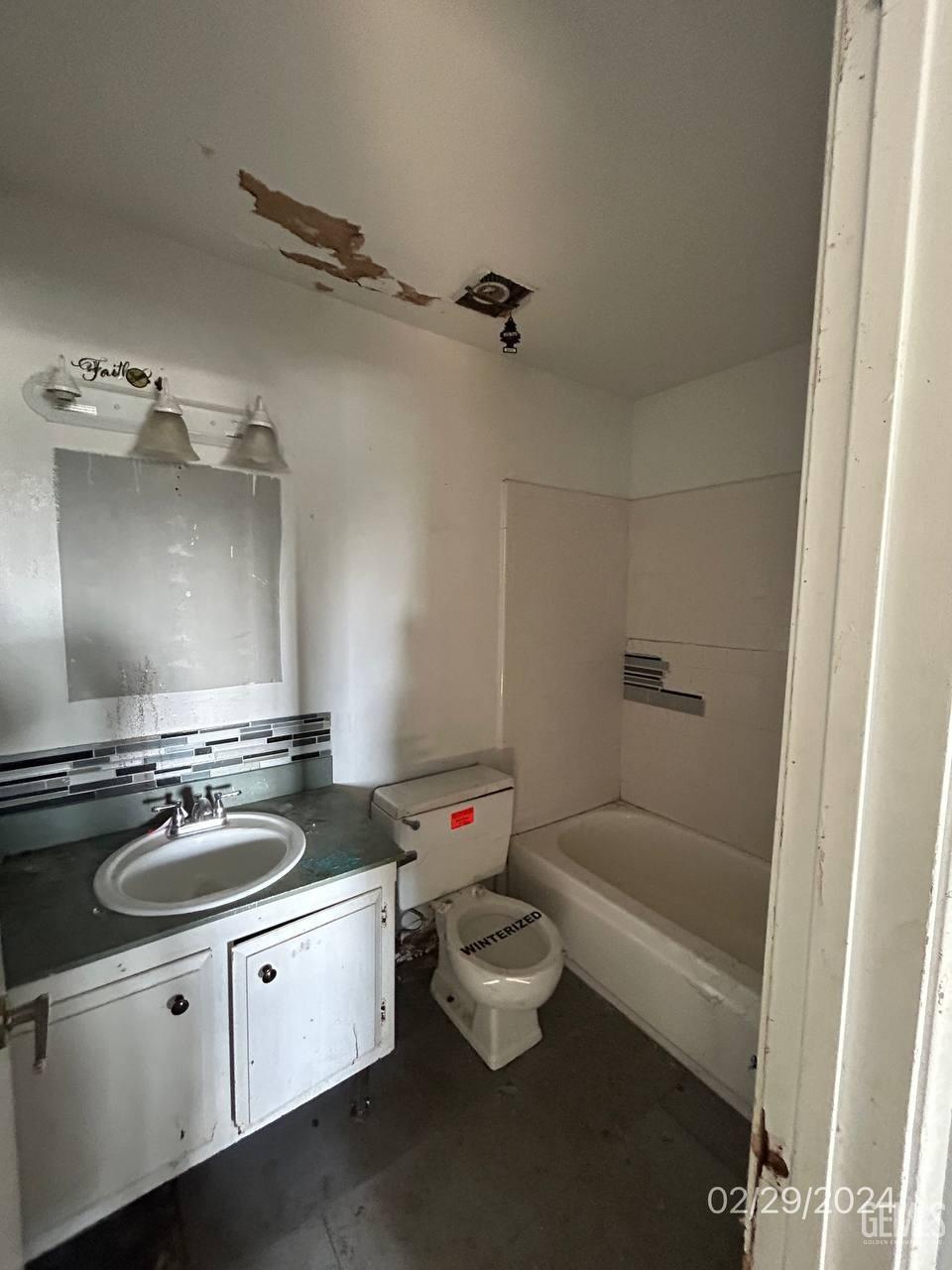 Undisclosed Address Bakersfield, CA 93301 - Photo 8 of 8 a bathroom with a sink and a mirror