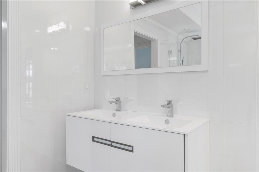 8965 Laurel Way Alpharetta, GA 30022 - Photo 32 of 79 a bathroom with a sink and a mirror