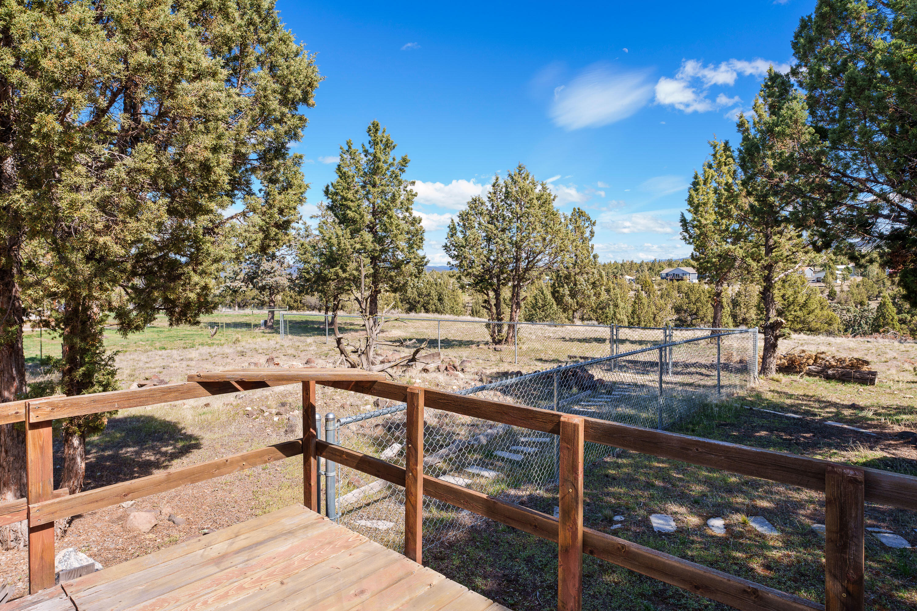 5674 Southeast Davis Loop Prineville, OR 97754 - Photo 29 of 48 a view of a yard with wooden fence