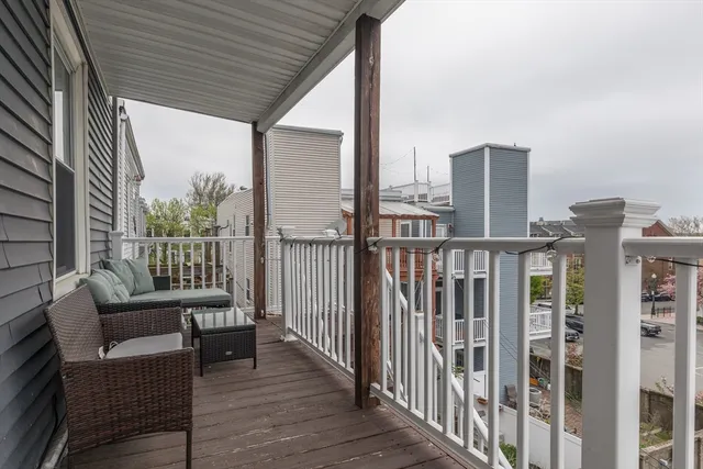 a view of a balcony with furniture