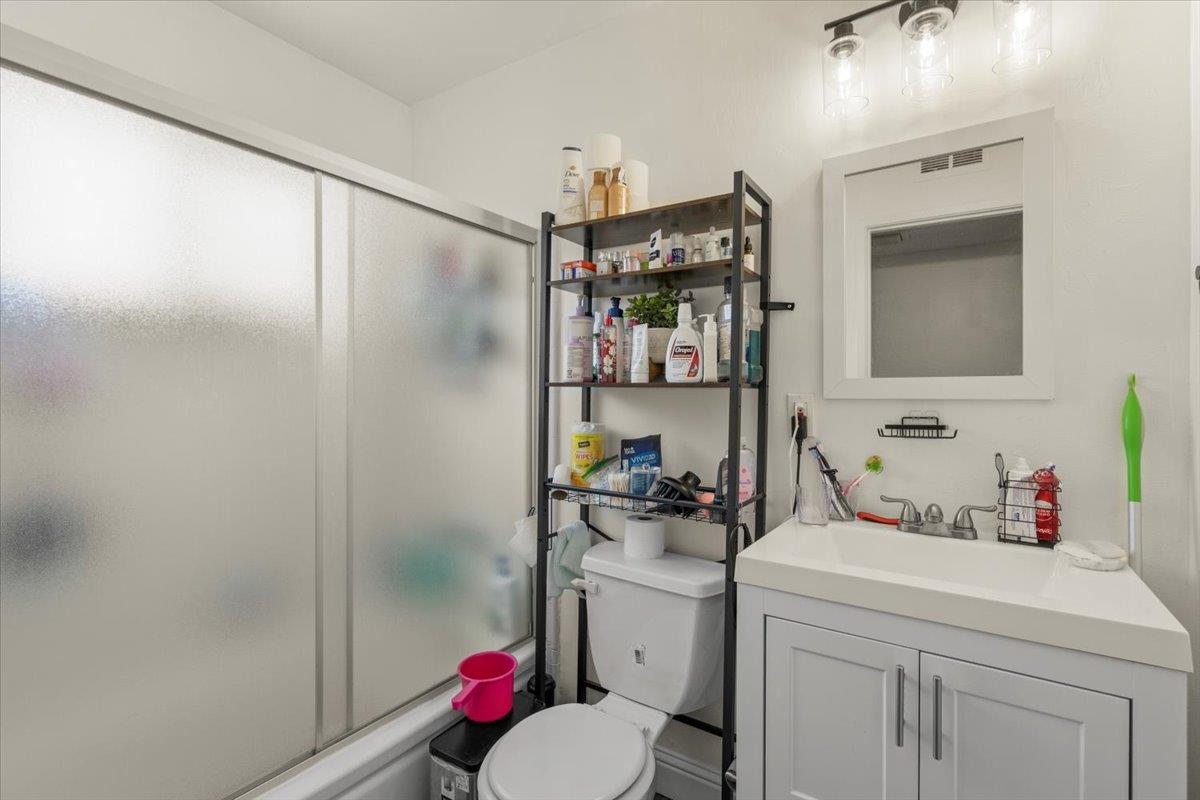 616 Canyon Road Redwood City, CA 94062 - Photo 7 of 11 a bathroom with a sink toilet and shower