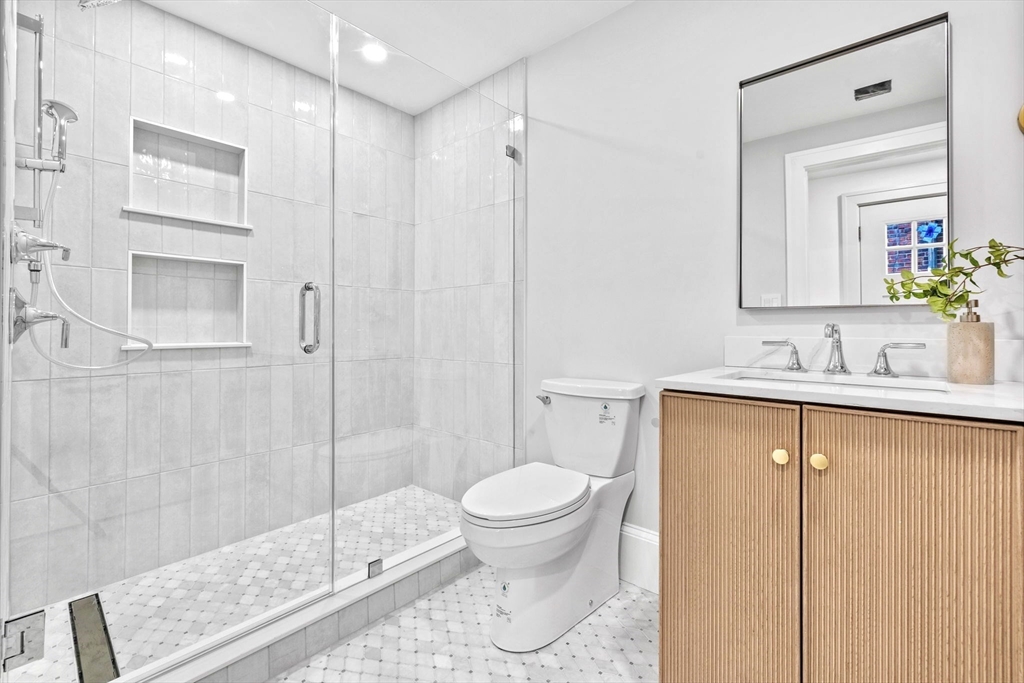 12 Prospect Street, Unit 2 Boston, MA 02129 - Photo 17 of 27 a bathroom with a sink a toilet and shower