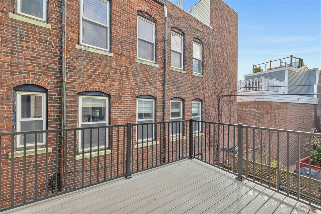 12 Prospect Street, Unit 2 Boston, MA 02129 - Photo 24 of 27 a view of a wooden roof deck