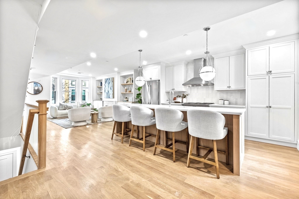 12 Prospect Street, Unit 2 Boston, MA 02129 - Photo 4 of 27 a large kitchen with a table and chairs