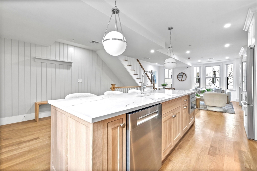 12 Prospect Street, Unit 2 Boston, MA 02129 - Photo 6 of 27 a large kitchen with kitchen island a large island in it