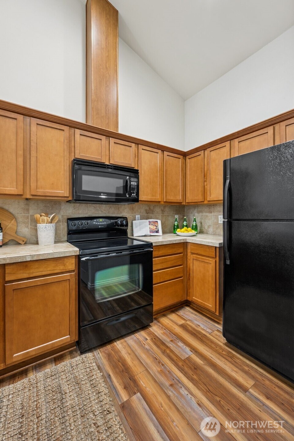 6509 Indiana Street Southeast Olympia, WA 98513 - Photo 14 of 24 a kitchen with stainless steel appliances kitchen island granite countertop a refrigerator stove and sink