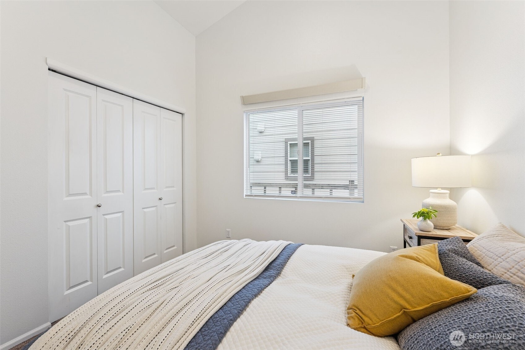 6509 Indiana Street Southeast Olympia, WA 98513 - Photo 16 of 24 a bedroom with a bed and lamp