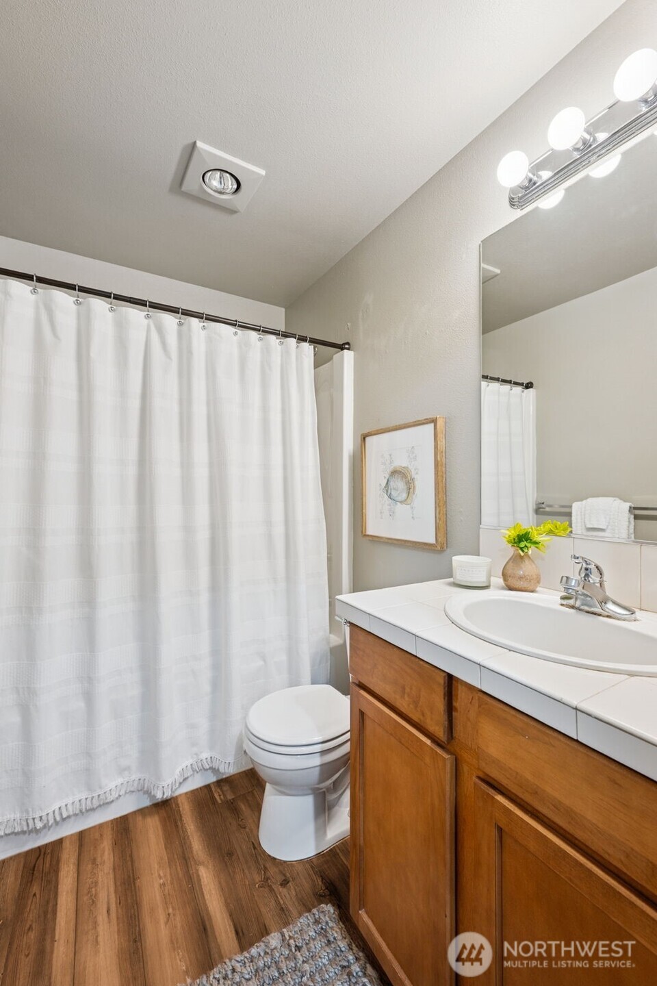 6509 Indiana Street Southeast Olympia, WA 98513 - Photo 17 of 24 a bathroom with a sink toilet and a mirror