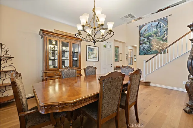 a large kitchen with a table and chairs