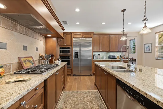 a view of a livingroom and dining room and wooden floor