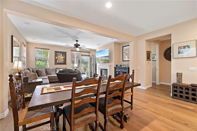 a living room with furniture fireplace and a large window