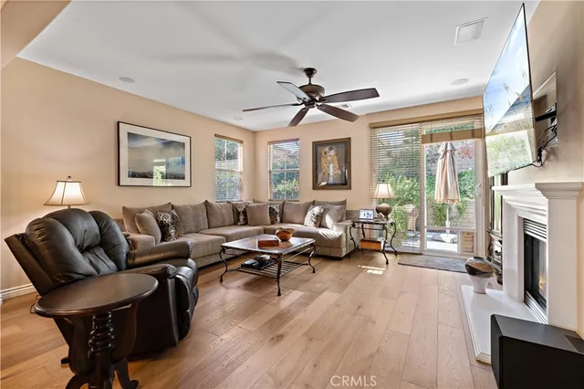 a bed room with a bed and a ceiling fan