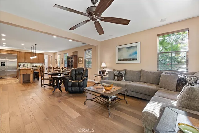 a spacious bathroom with a double vanity sink a large mirror and a bathtub