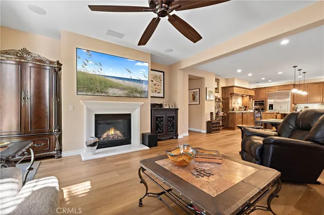 a bathroom with a granite countertop sink a toilet and a large mirror