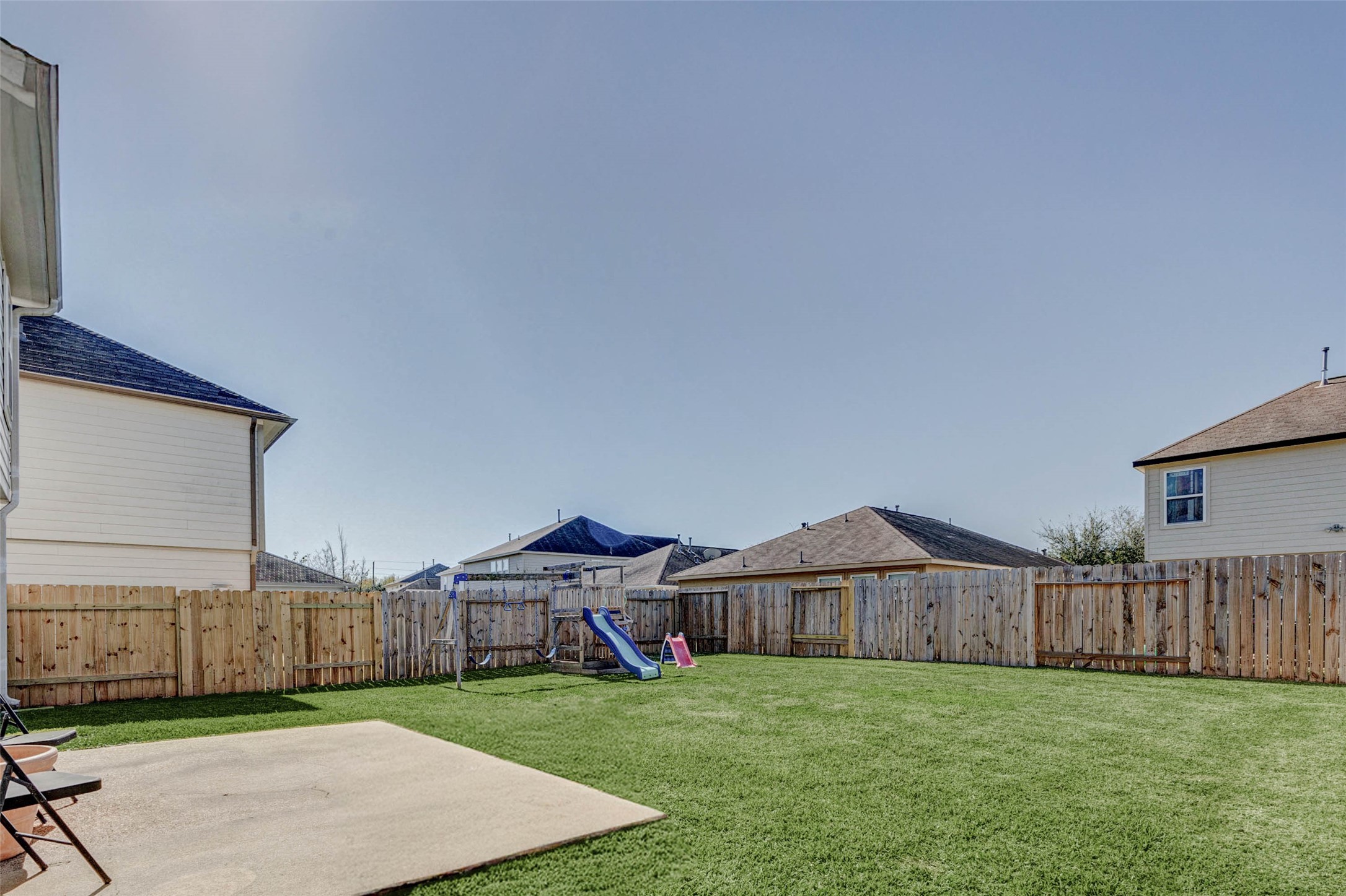 3027 Upland Spring Trace Katy, TX 77493 - Photo 26 of 29 a view of a house with a yard and wooden fence