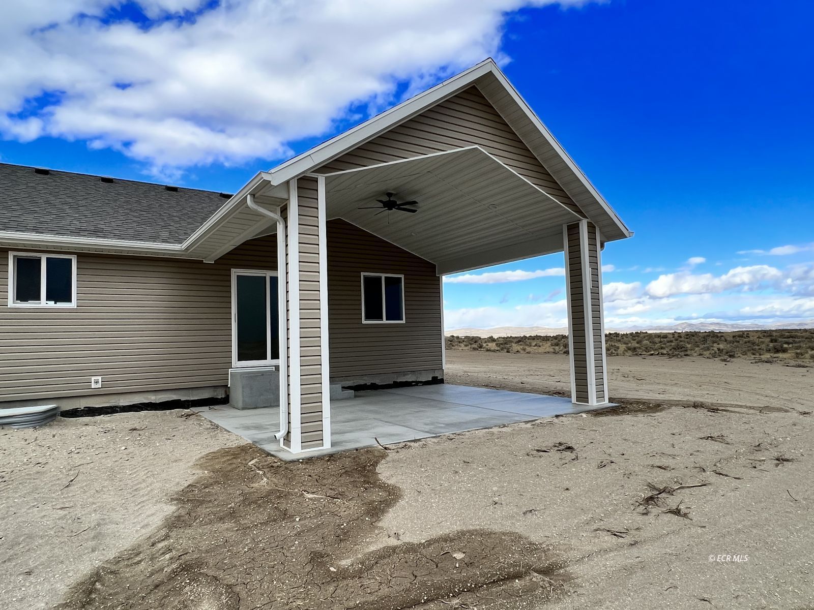 625 Sun Vly Road Spring Creek, NV 89815 - Photo 31 of 38 a view of a house with a yard
