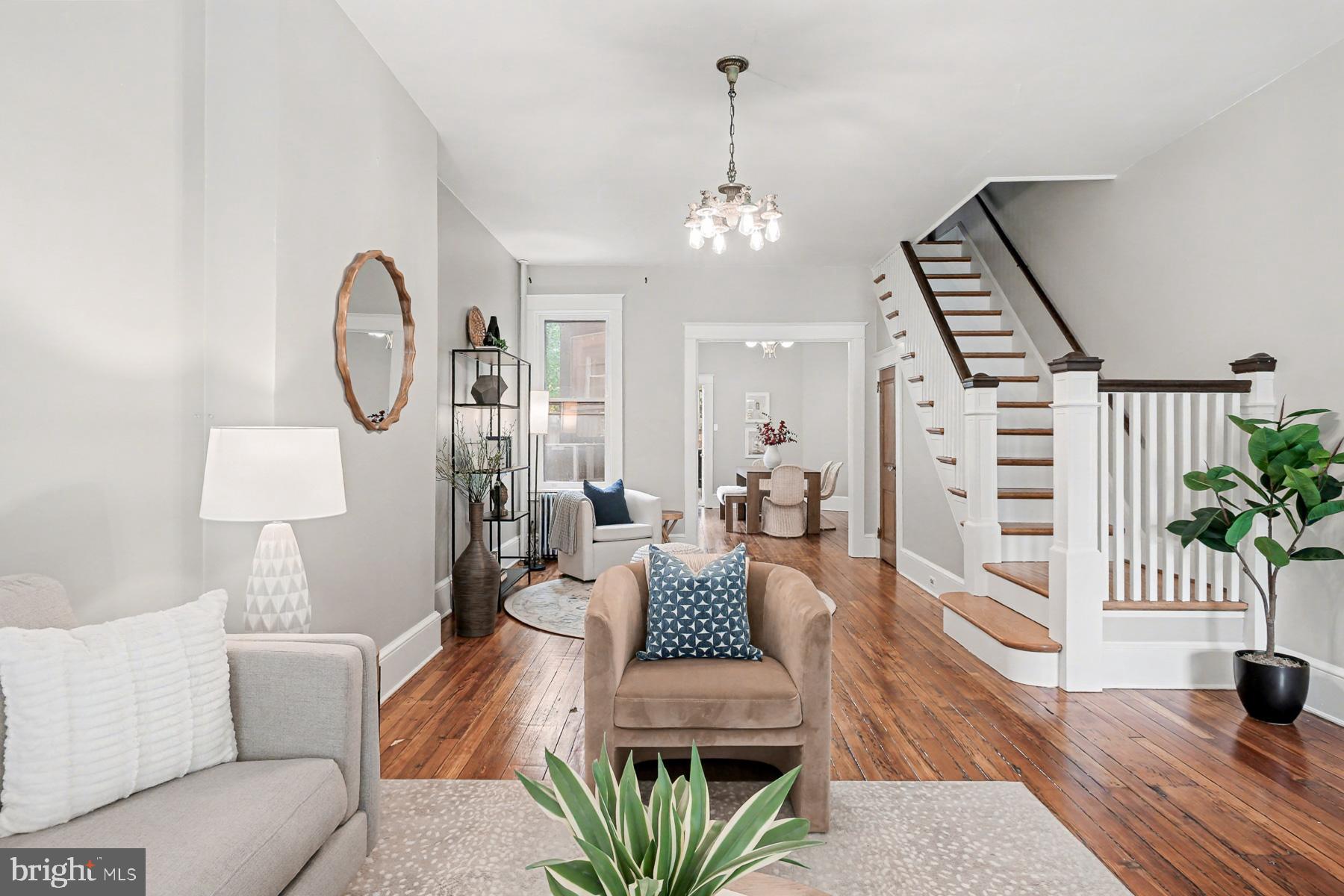 16 West Liberty Street Lancaster, PA 17603 - Photo 11 of 55 a living room with furniture a chandelier and wooden floor