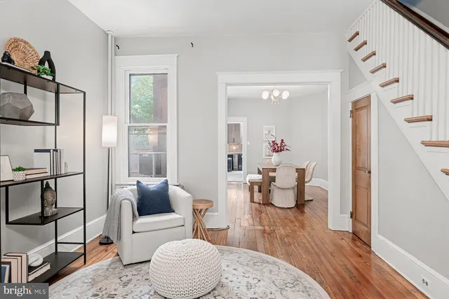 a view of a dining room with furniture window and wooden floor
