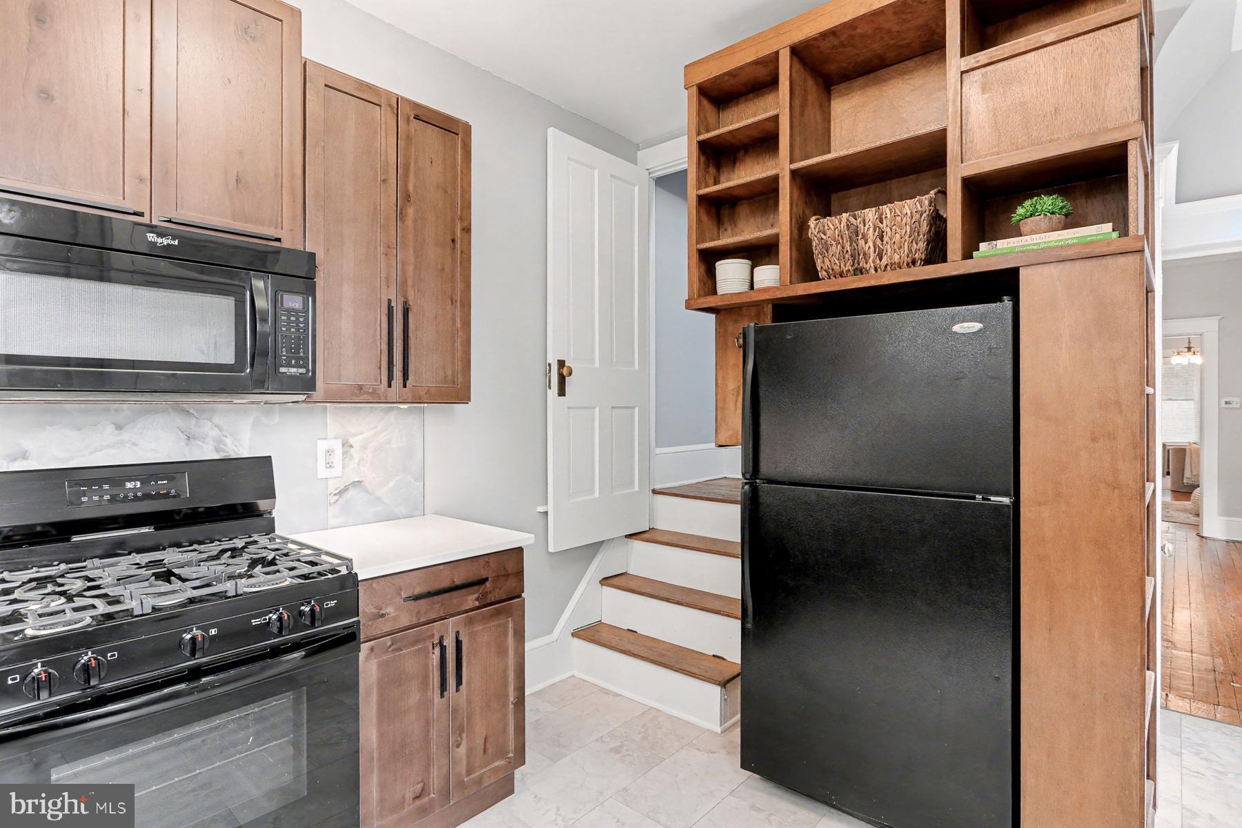 16 West Liberty Street Lancaster, PA 17603 - Photo 20 of 55 a kitchen with stainless steel appliances granite countertop a refrigerator and a stove top oven