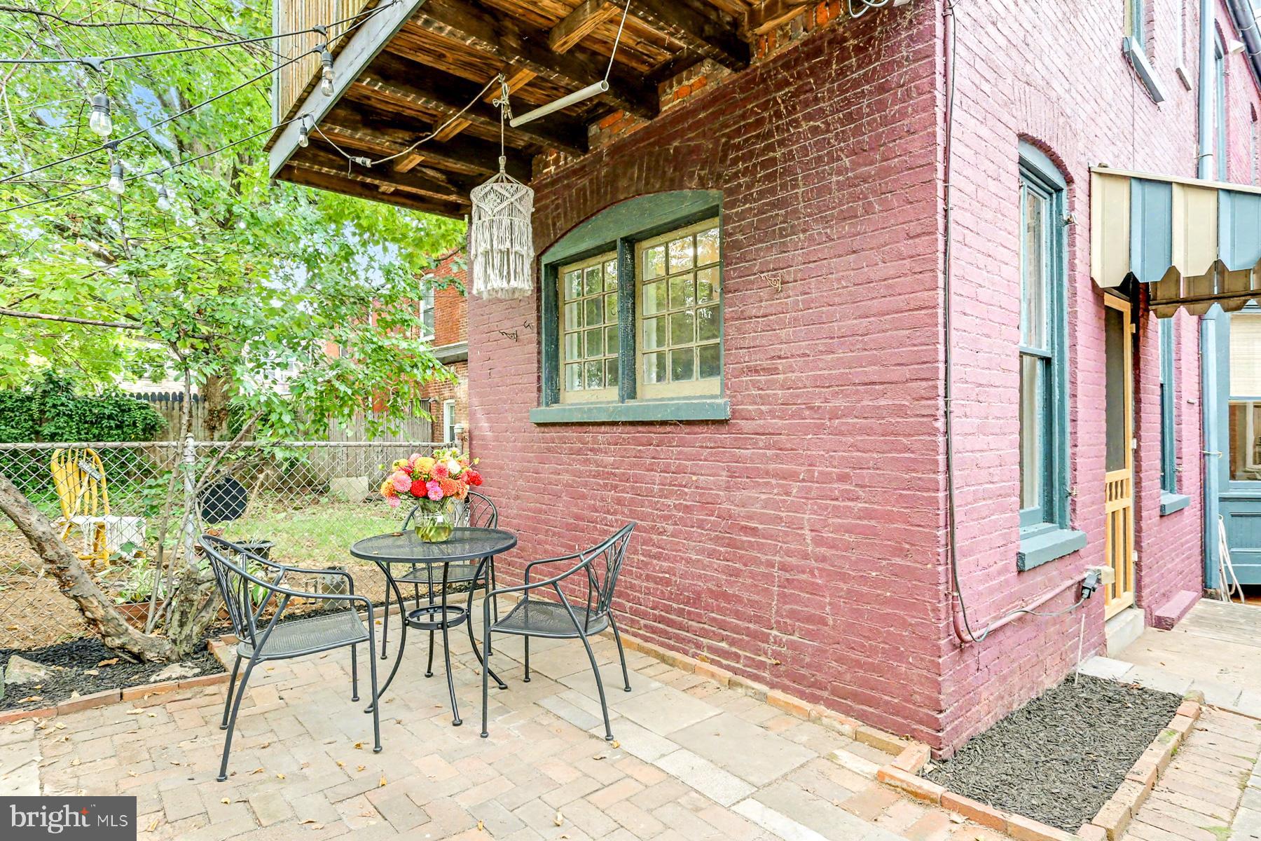 16 West Liberty Street Lancaster, PA 17603 - Photo 22 of 55 a backyard of a house with table and chairs